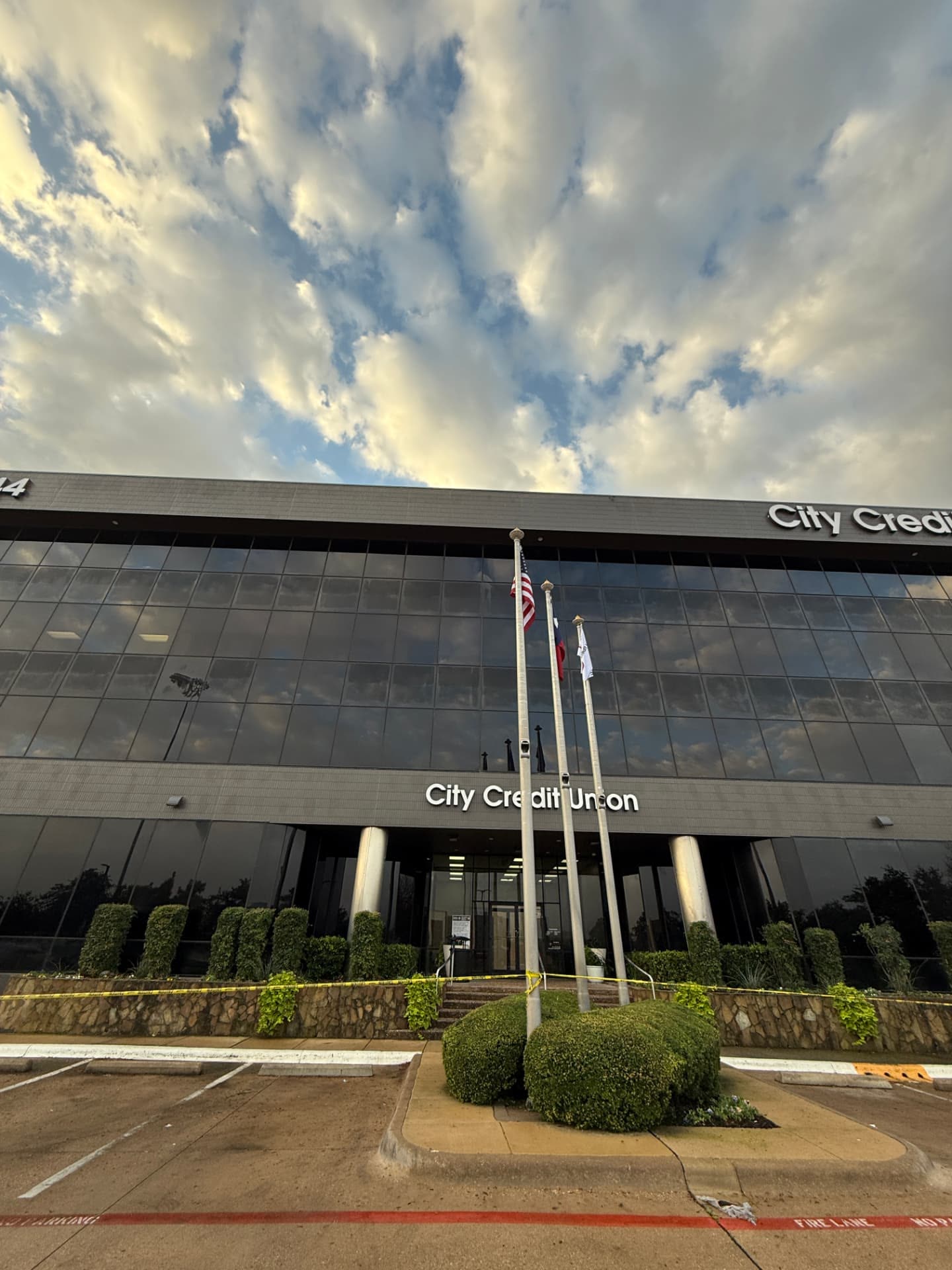 Commercial credit union building with dark glass facade