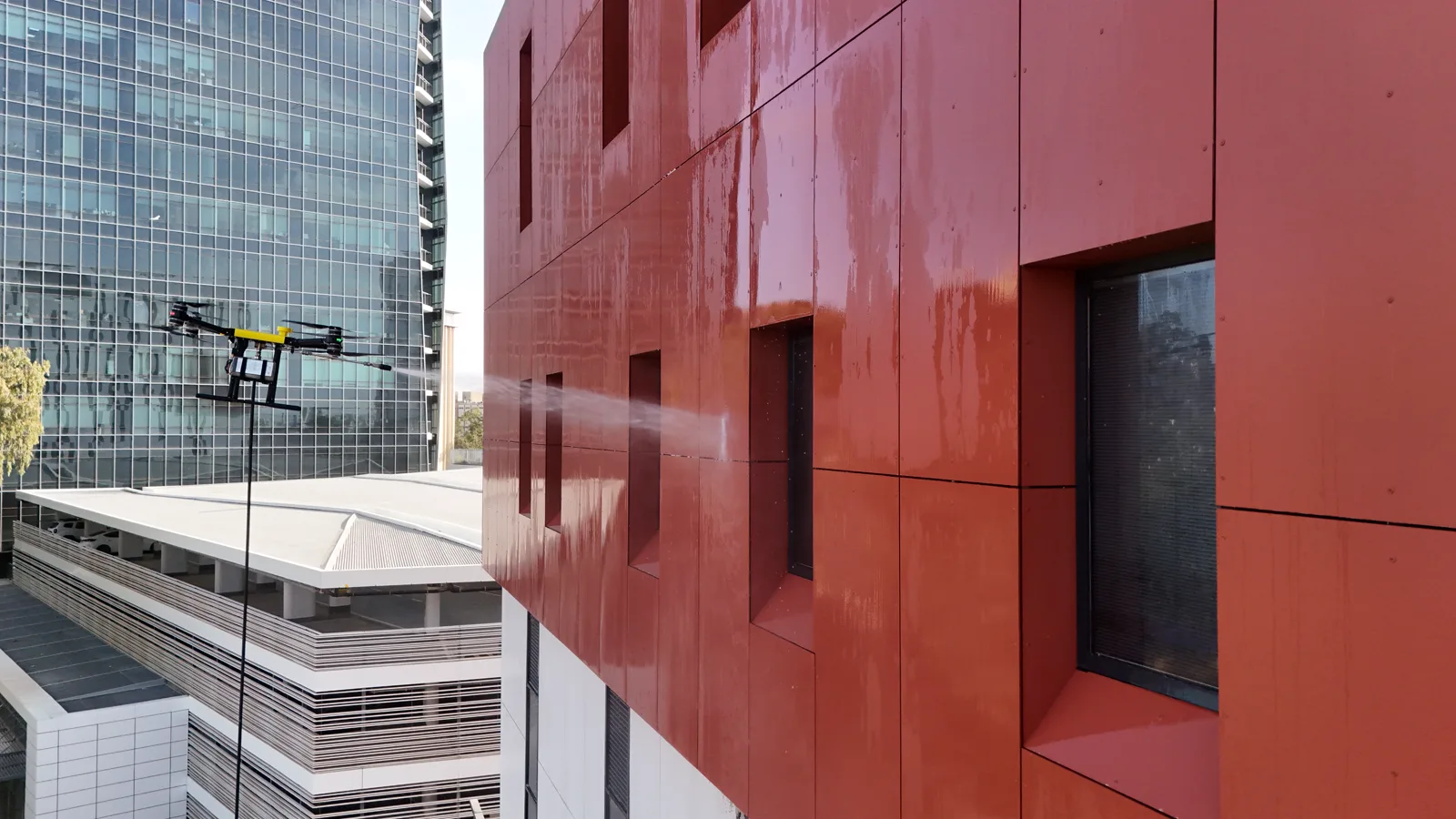 Apellix cleaning drone working on a commercial building